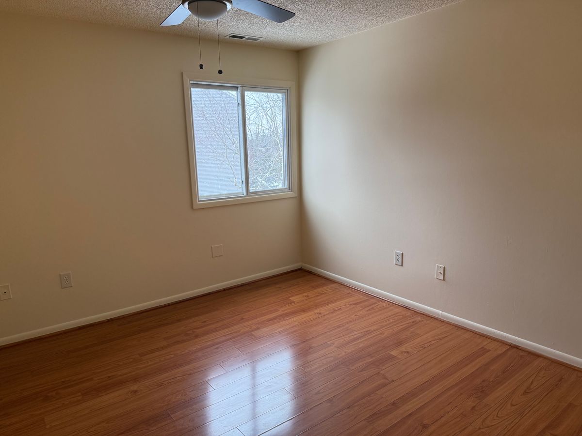 Bedroom with hardwood floors and ceiling fan